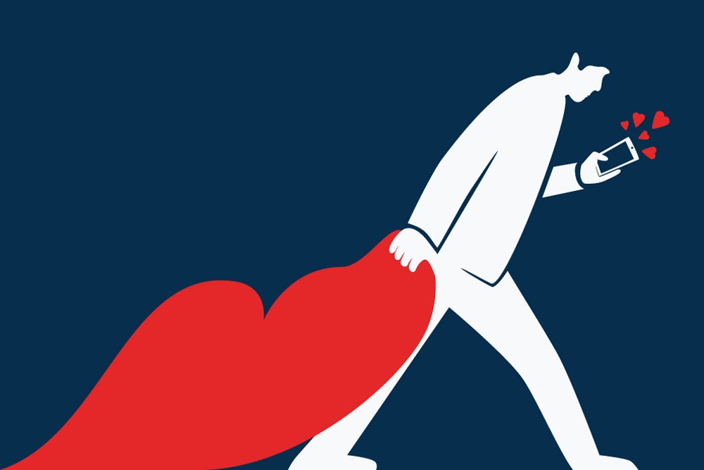 A man drags a heart while looking at the phone