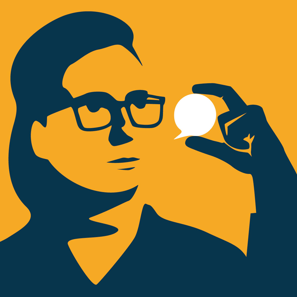 A man looks at a tiny speech bubble.